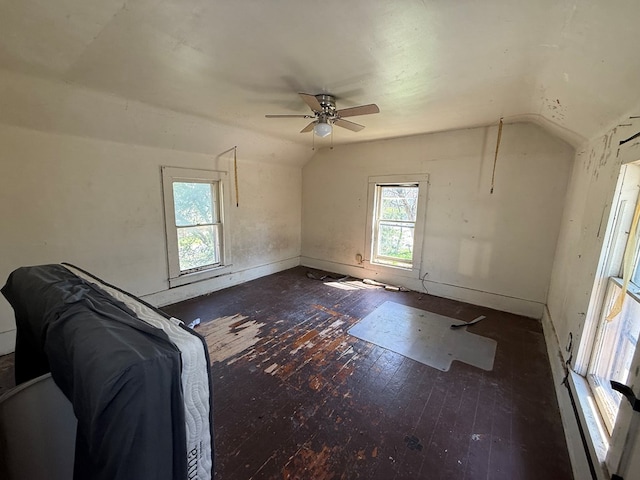1015 N Cole St, Lima, OH 44805 - interior space with baseboards, ceiling fan, vaulted ceiling, and hardwood / wood-style floors