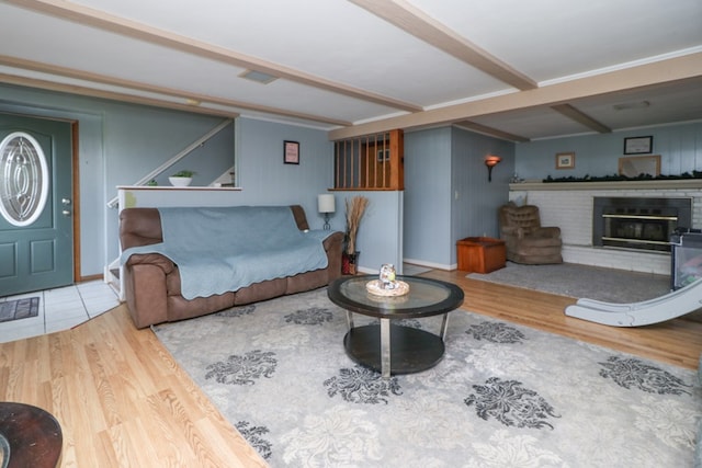 1321 W Hanley Rd, Mansfield, OH 44904 - living area featuring beam ceiling, wood finished floors, and a fireplace