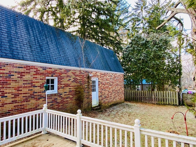 view of side of home featuring a deck