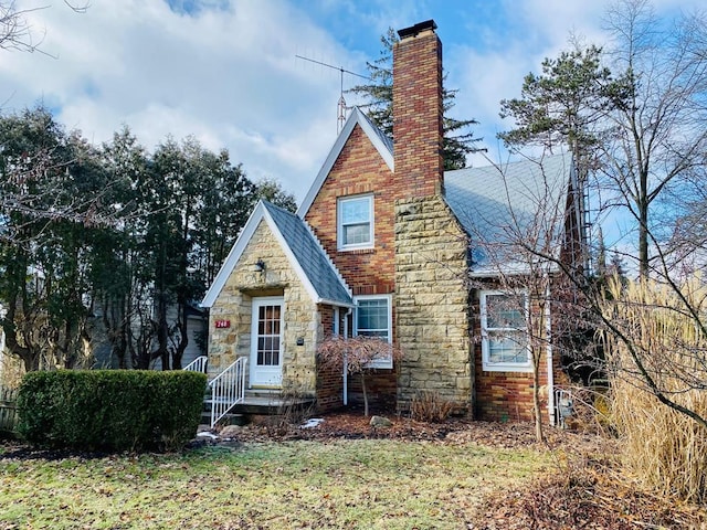 tudor house with a front yard