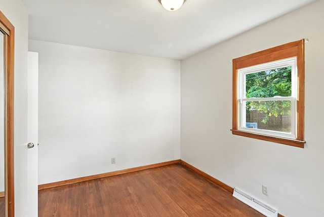 438 Mackey St, Galion, OH 44833 - spare room with baseboard heating and wood finished floors
