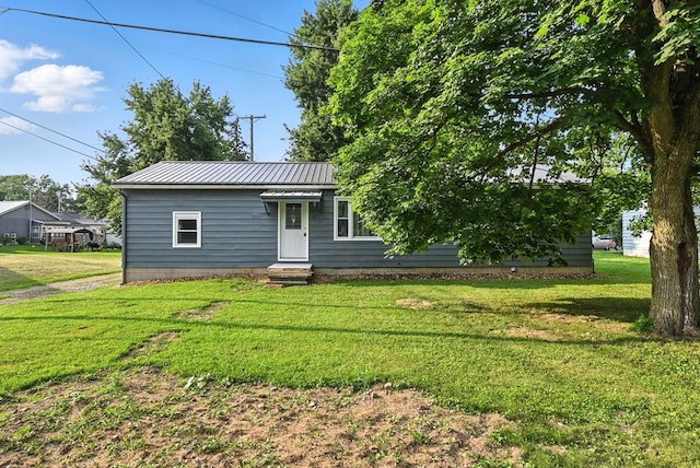 438 Mackey St, Galion, OH 44833 - view of front of house featuring a front lawn and a metal roof