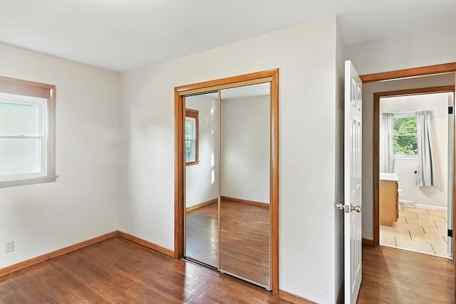 438 Mackey St, Galion, OH 44833 - unfurnished bedroom with a closet and wood finished floors