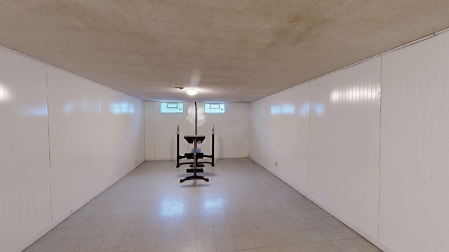 basement featuring a textured ceiling