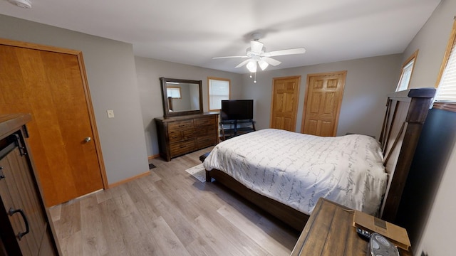 bedroom with ceiling fan and light wood-type flooring