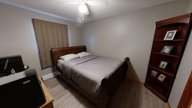 bedroom with ceiling fan and light wood-type flooring