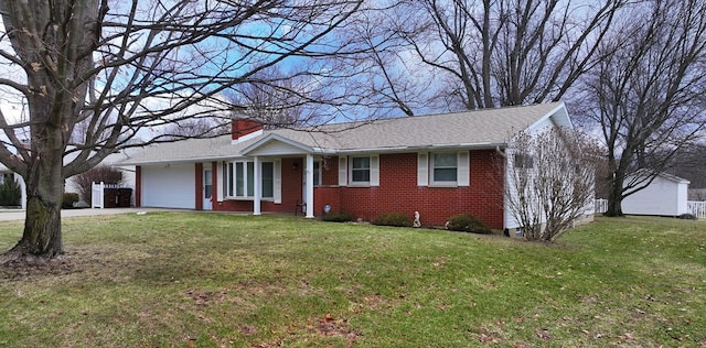 single story home with a garage and a front yard