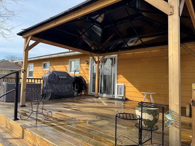 deck with a grill and cooling unit