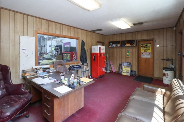 office featuring dark carpet and wood walls