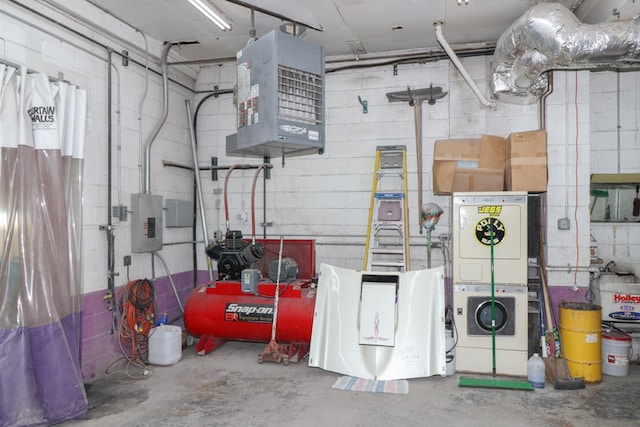 interior space featuring stacked washer / dryer