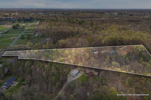 bird's eye view featuring a forest view