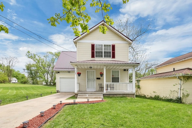 528 N Mulberry St, Street, OH 44902 - traditional-style home with a porch, driveway, a front yard, a garage, and metal roof