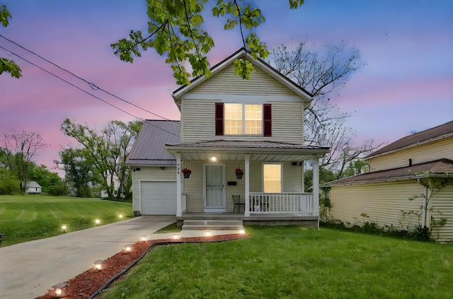 528 N Mulberry St, Street, OH 44902 - traditional-style house featuring a porch, concrete driveway, a front yard, and an attached garage