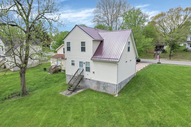 528 N Mulberry St, Street, OH 44902 - rear view of property with metal roof and a lawn