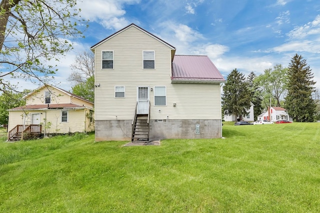 528 N Mulberry St, Street, OH 44902 - back of property with metal roof, a yard, and entry steps