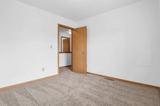 528 N Mulberry St, Street, OH 44902 - carpeted empty room featuring baseboards