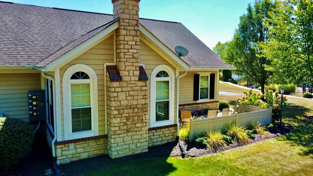 view of side of property featuring a yard