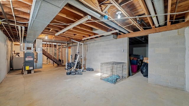 basement with heating unit and washer / clothes dryer