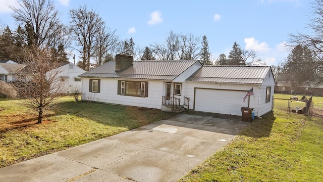 view of front of house with a garage and a front yard