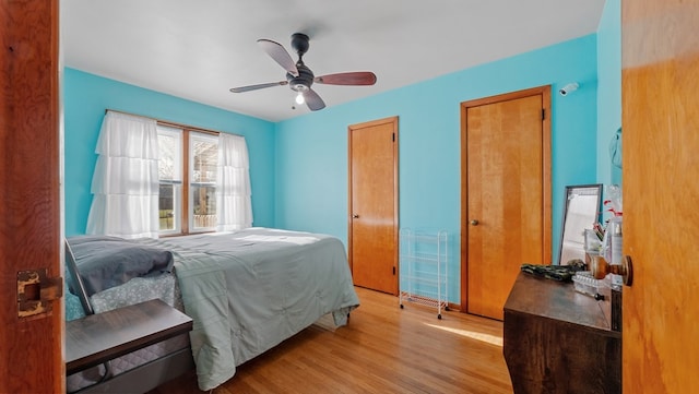 bedroom featuring ceiling fan and light hardwood / wood-style floors