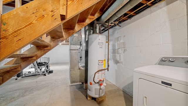 basement with gas water heater and washer / dryer