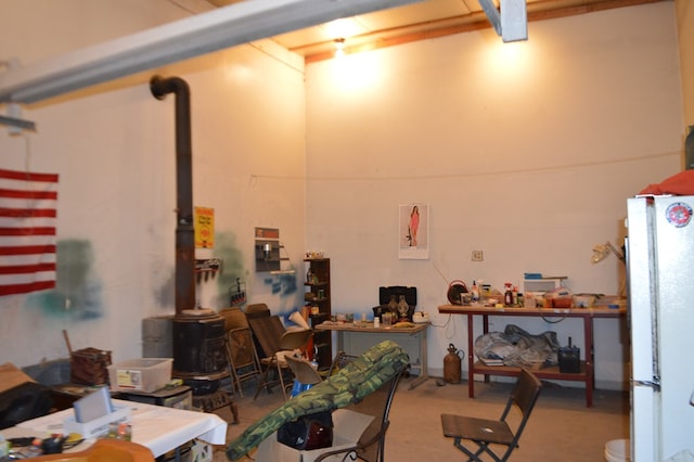 5067 N State Route 4, Bucyrus, OH 44820 - garage featuring freestanding refrigerator and a wood stove