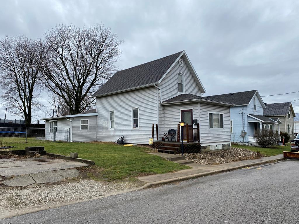 view of side of property with a yard