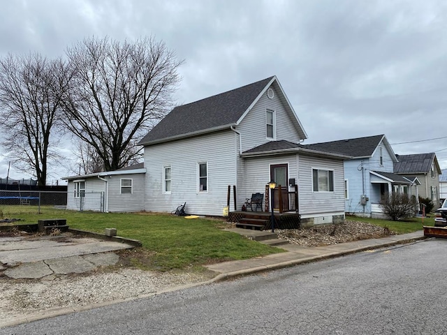 view of side of property with a yard