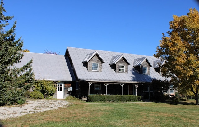 cape cod home with a front yard