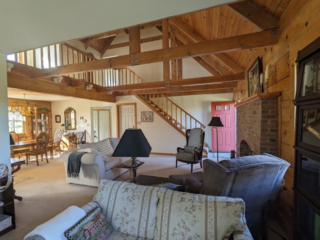 carpeted living room featuring beamed ceiling, wood ceiling, high vaulted ceiling, and an inviting chandelier