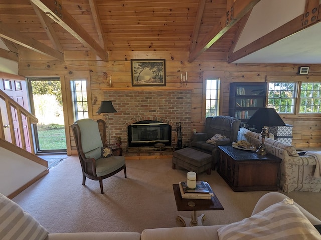 living room featuring a fireplace, vaulted ceiling with beams, wooden walls, and wood ceiling