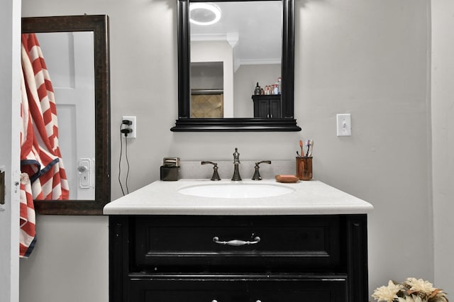 bathroom with vanity and ornamental molding