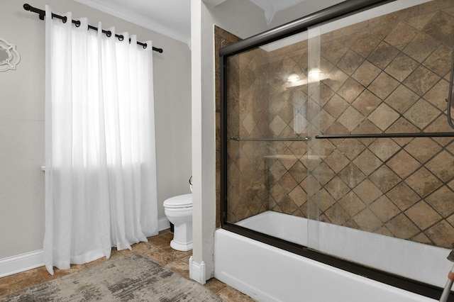 bathroom with tile patterned flooring, bath / shower combo with glass door, and toilet