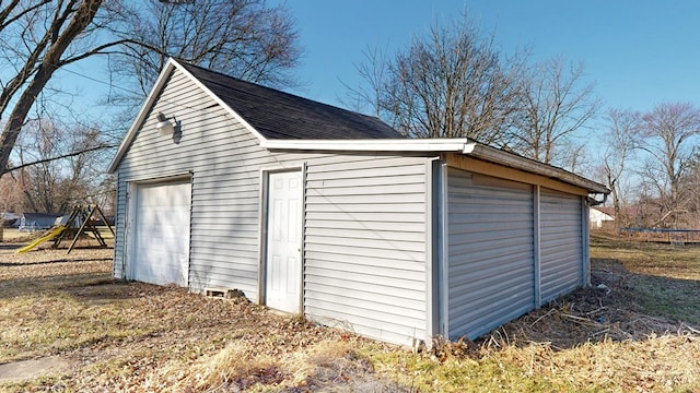 view of outbuilding with a trampoline and an outdoor structure