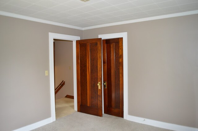 1211 S Sandusky Ave, Bucyrus, OH 44820 - carpeted spare room featuring crown molding and baseboards