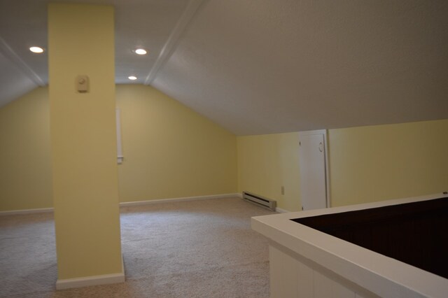 1211 S Sandusky Ave, Bucyrus, OH 44820 - additional living space featuring light colored carpet, a baseboard heating unit, lofted ceiling, recessed lighting, and baseboards