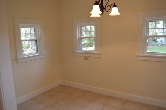 1211 S Sandusky Ave, Bucyrus, OH 44820 - unfurnished room with plenty of natural light, baseboards, and a chandelier