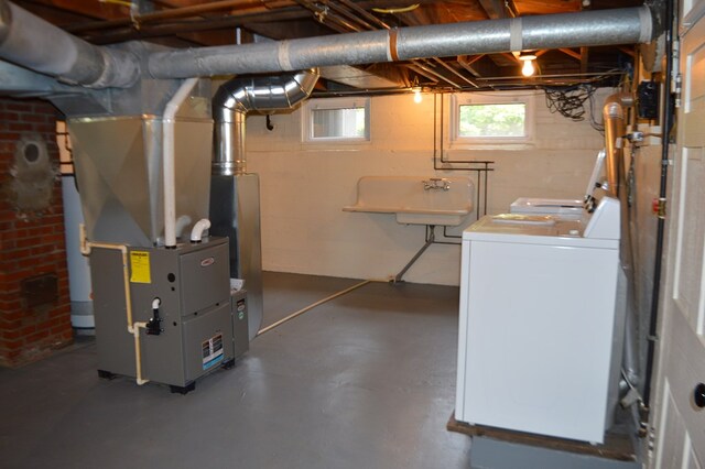 1211 S Sandusky Ave, Bucyrus, OH 44820 - below grade area featuring separate washer and dryer and heating unit