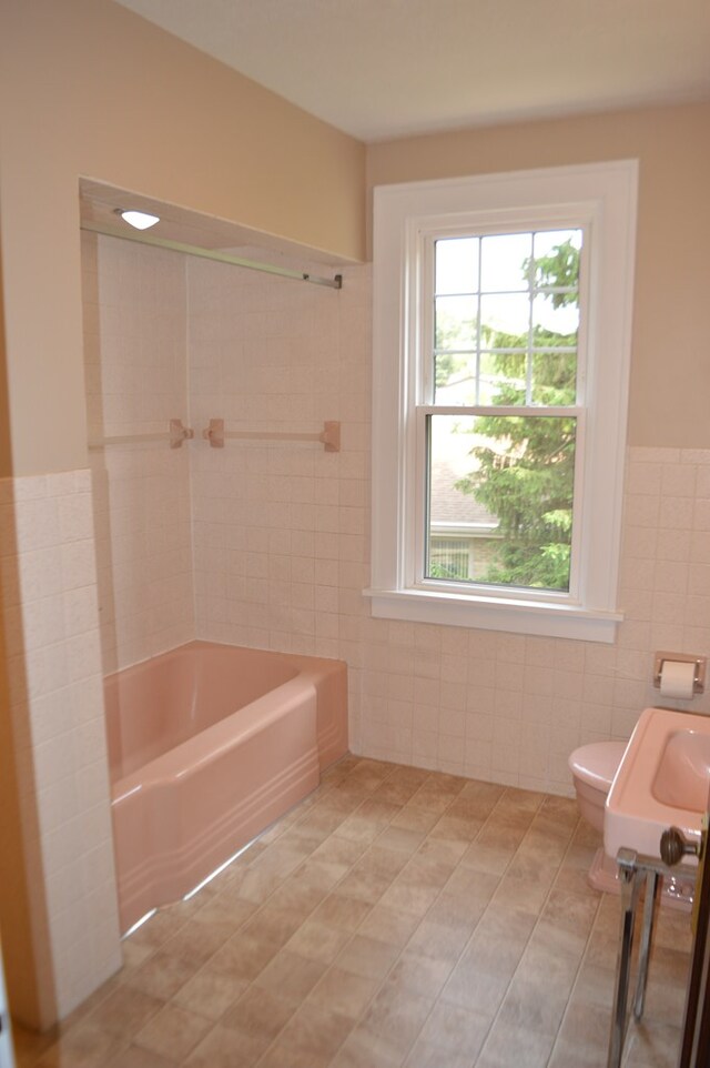 1211 S Sandusky Ave, Bucyrus, OH 44820 - bathroom featuring tile walls, vanity, toilet, and tile patterned floors