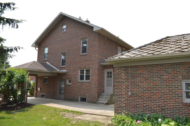1211 S Sandusky Ave, Bucyrus, OH 44820 - rear view of house with entry steps and brick siding