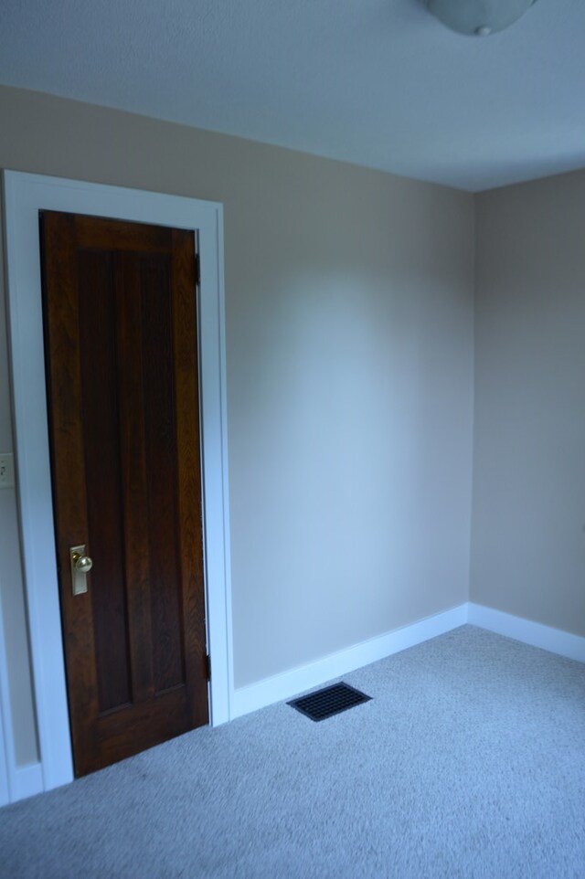 1211 S Sandusky Ave, Bucyrus, OH 44820 - spare room featuring carpet and baseboards