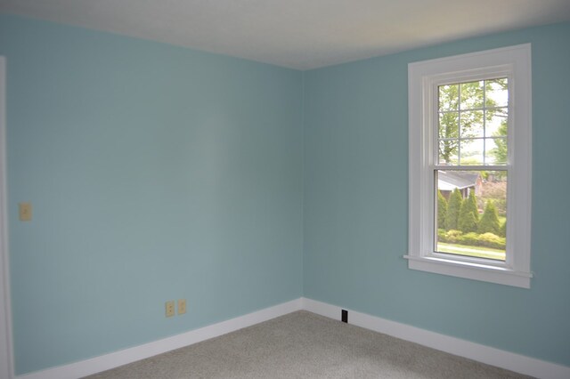 1211 S Sandusky Ave, Bucyrus, OH 44820 - spare room featuring carpet flooring and baseboards