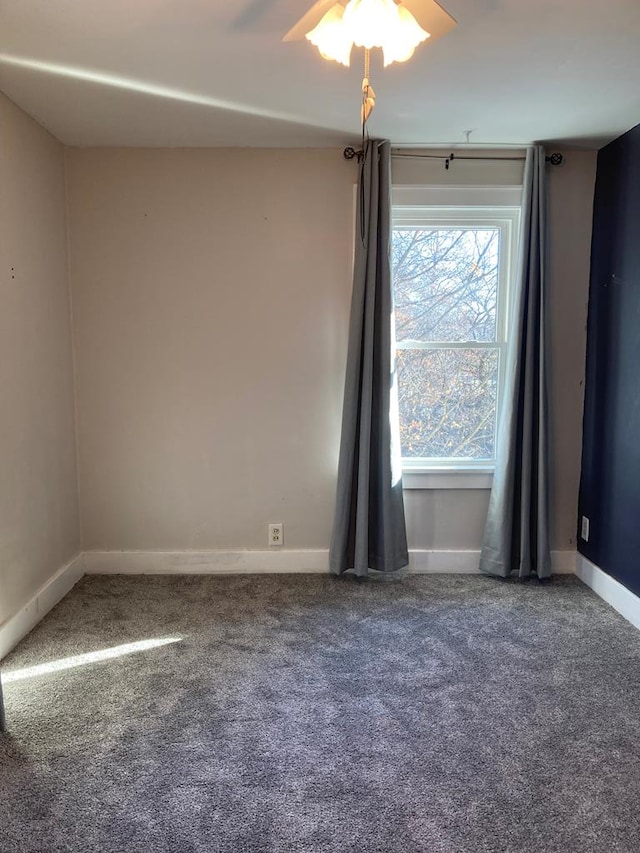 carpeted empty room with ceiling fan