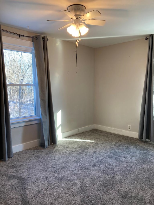 carpeted empty room with ceiling fan