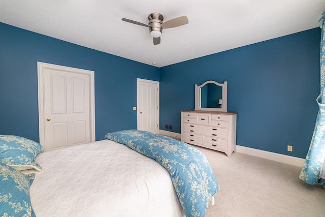 carpeted bedroom with ceiling fan