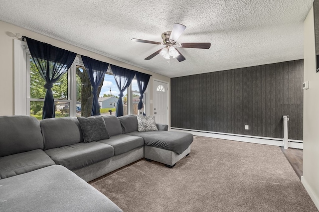 426 Charvid Ave, Mansfield, OH 44905 - living area featuring ceiling fan, a baseboard heating unit, a textured ceiling, and carpet floors