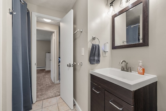 426 Charvid Ave, Mansfield, OH 44905 - bathroom featuring vanity, tile patterned flooring, and a baseboard heating unit