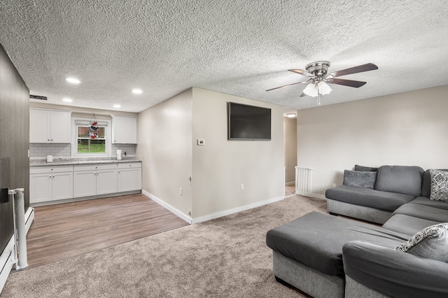 426 Charvid Ave, Mansfield, OH 44905 - living room featuring light colored carpet, a ceiling fan, recessed lighting, and a textured ceiling