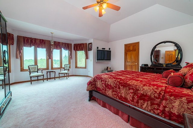 carpeted bedroom featuring ceiling fan and lofted ceiling