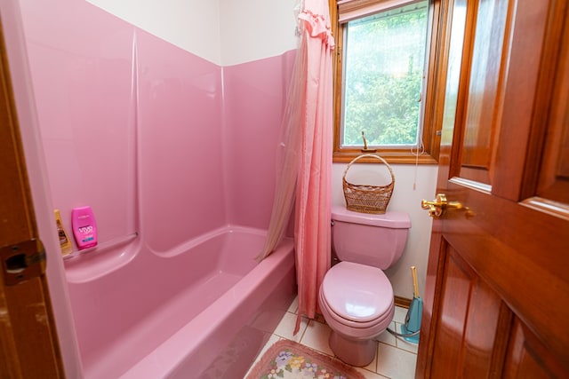 bathroom with tile patterned floors, shower / bathtub combination with curtain, and toilet